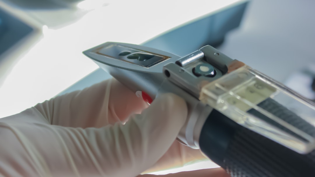 person holding gray and black semi automatic pistol