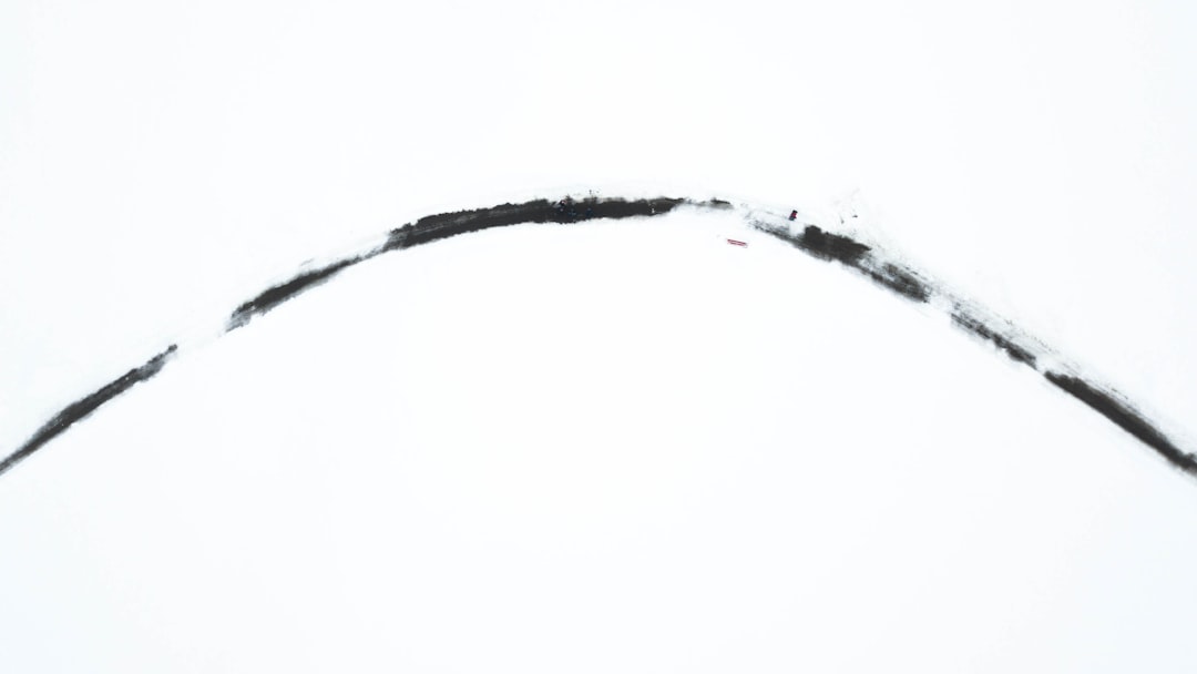 a jet flying through the sky with a trail of smoke coming out of it