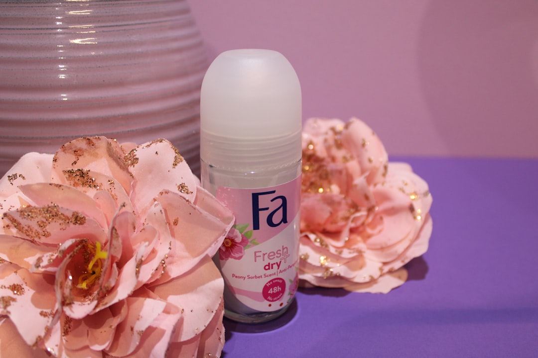 a close up of a bottle of deodorant on a table