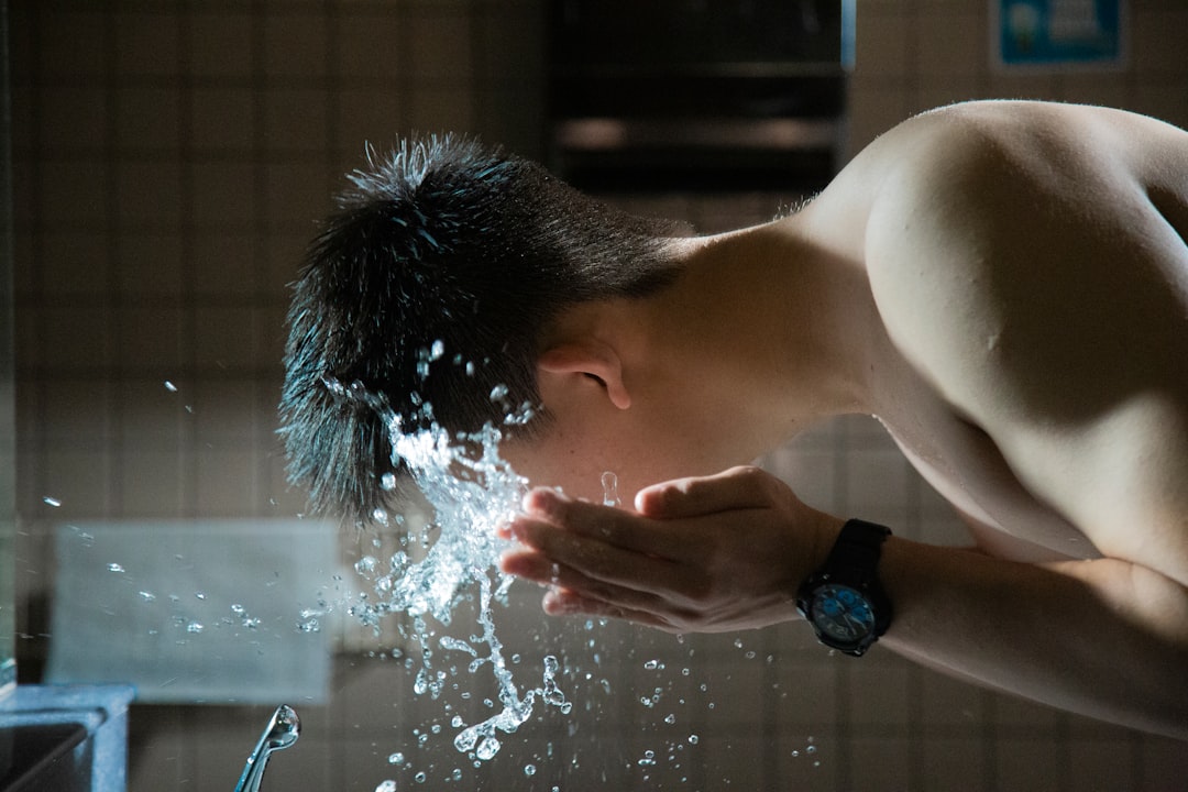men washing face
