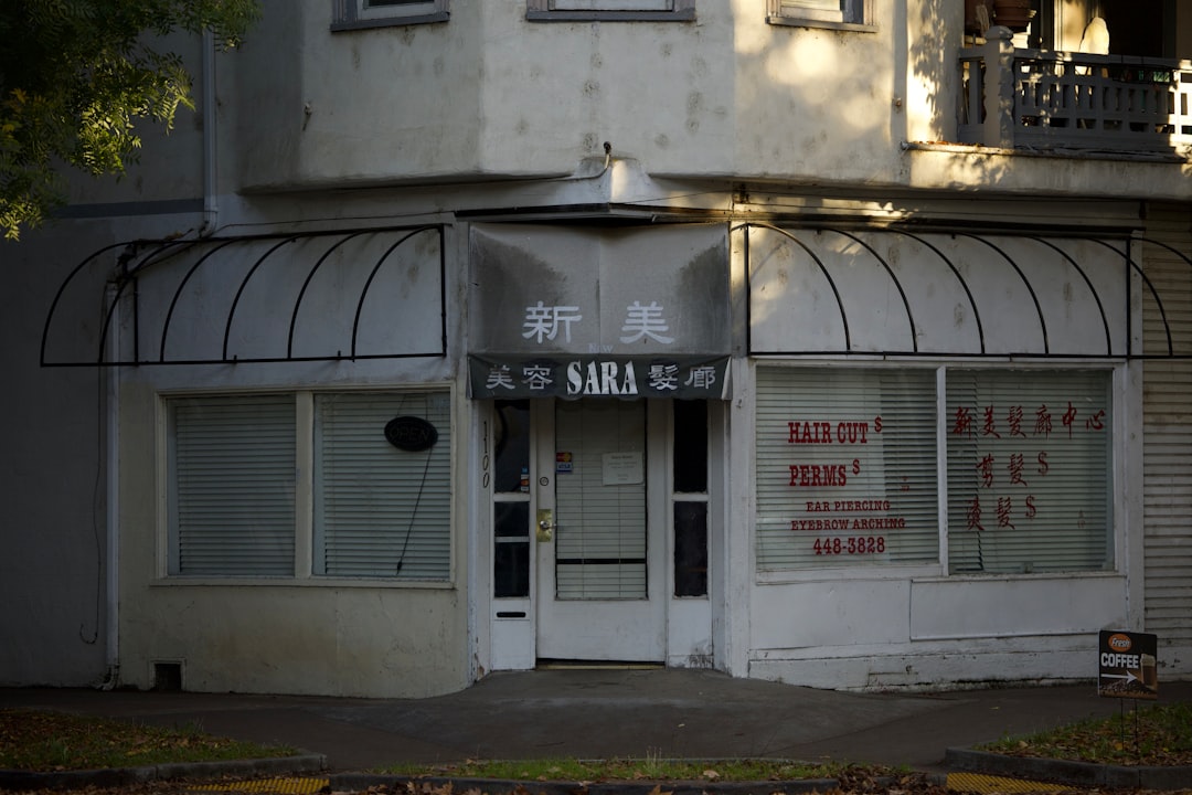 A storefront with awnings and signs.
